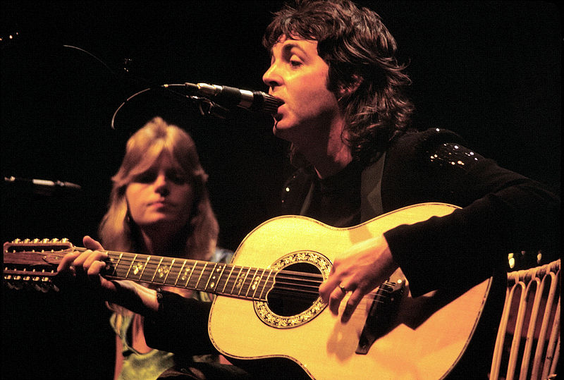 Paul McCartney performing with wife Linda in 1976.